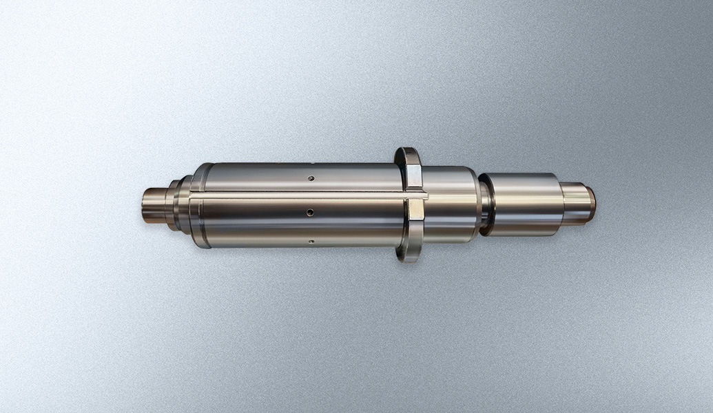 This image shows a cylindrical metal object, which appears to be a catalytic converter, commonly used in car exhaust systems, against a grey background.