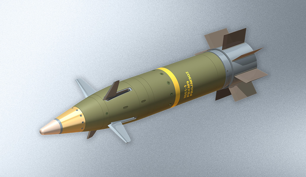 This is a 3D rendering of a missile with a green body, gold nose cone, and gray fins, displayed against a textured gray background.