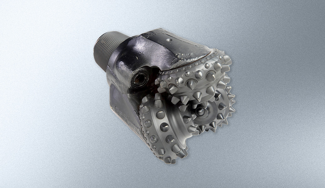 This is an image of a well-used bicycle cassette and freehub, showing the gears and sprockets with a gradient gray background.